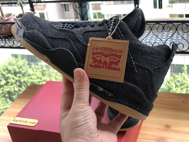 Levi's x Air Jordan 4 'Black Denim' In-Hand Side Images Levi's x Air Jordan 4 'Black Denim' In-Hand Side Images